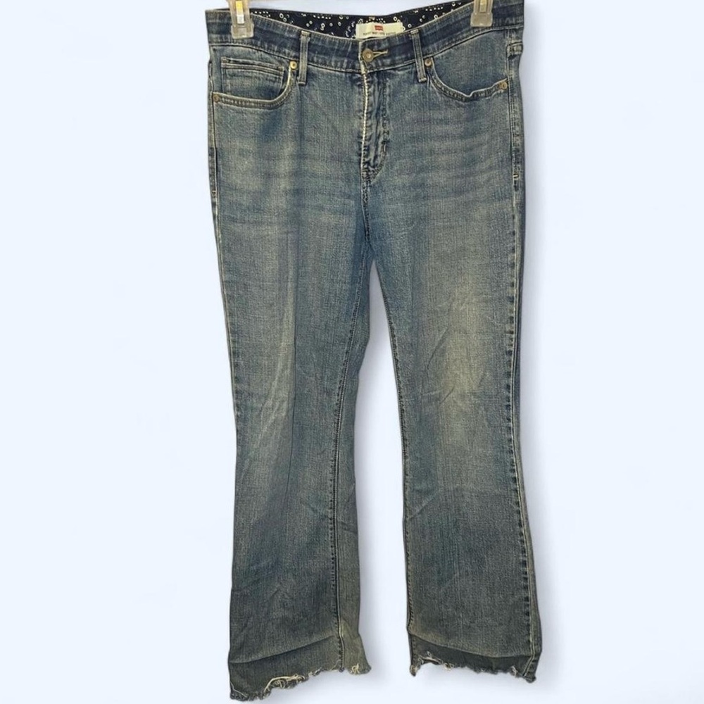 Levi's blue bootcut jeans with frayed hem